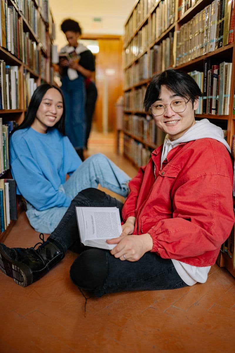 A learner smiling while studying
